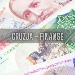 Zbliżenie na gruzińskie banknoty z napisem "Gruzja - Finanse".