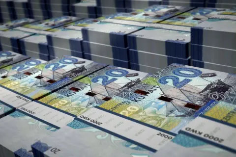 Stosy banknotów 20 dinarów kuwejckich, jednej z najdroższych walut na świecie.