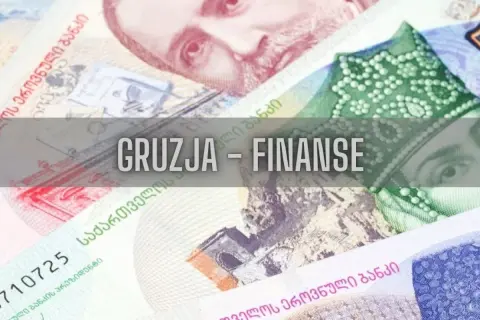 Zbliżenie na gruzińskie banknoty z napisem "Gruzja - Finanse".