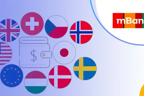 Jak założyć konto walutowe w mBank? Grafika przedstawia portfel z symbolem dolara otoczony flagami różnych krajów, sugerując międzynarodowe możliwości finansowe.