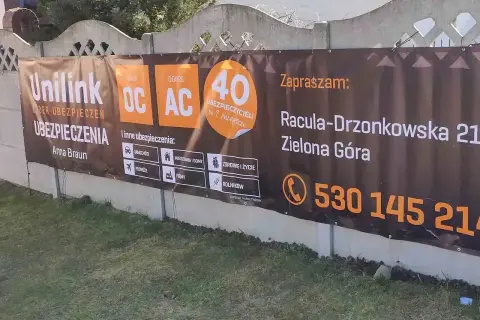 Baner reklamowy Unilink z informacją o ubezpieczeniach OC, AC, adresie i numerze telefonu w Zielonej Górze.