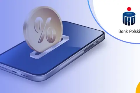 Moneta z symbolem procenta wsuwana do smartfona. Sprawdź, jakie lokaty oferuje PKO BP i pomnażaj swoje oszczędności.