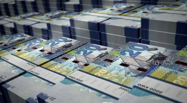 Stosy banknotów 20 dinarów kuwejckich, jednej z najdroższych walut na świecie.