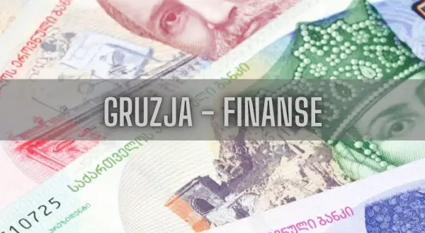 Zbliżenie na gruzińskie banknoty z napisem "Gruzja - Finanse".