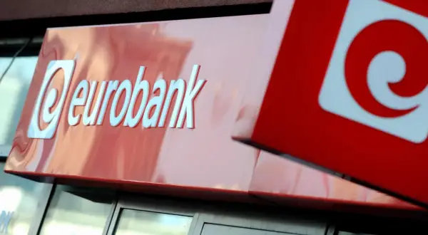 Logo eurobank na czerwonym tle. Obok widoczny fragment innego znaku, również z czerwonym elementem.