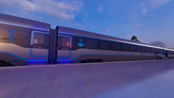 Nowoczesny pociąg PKP Intercity z niebieskimi akcentami i podświetlanymi numerami wagonów na tle nieba.